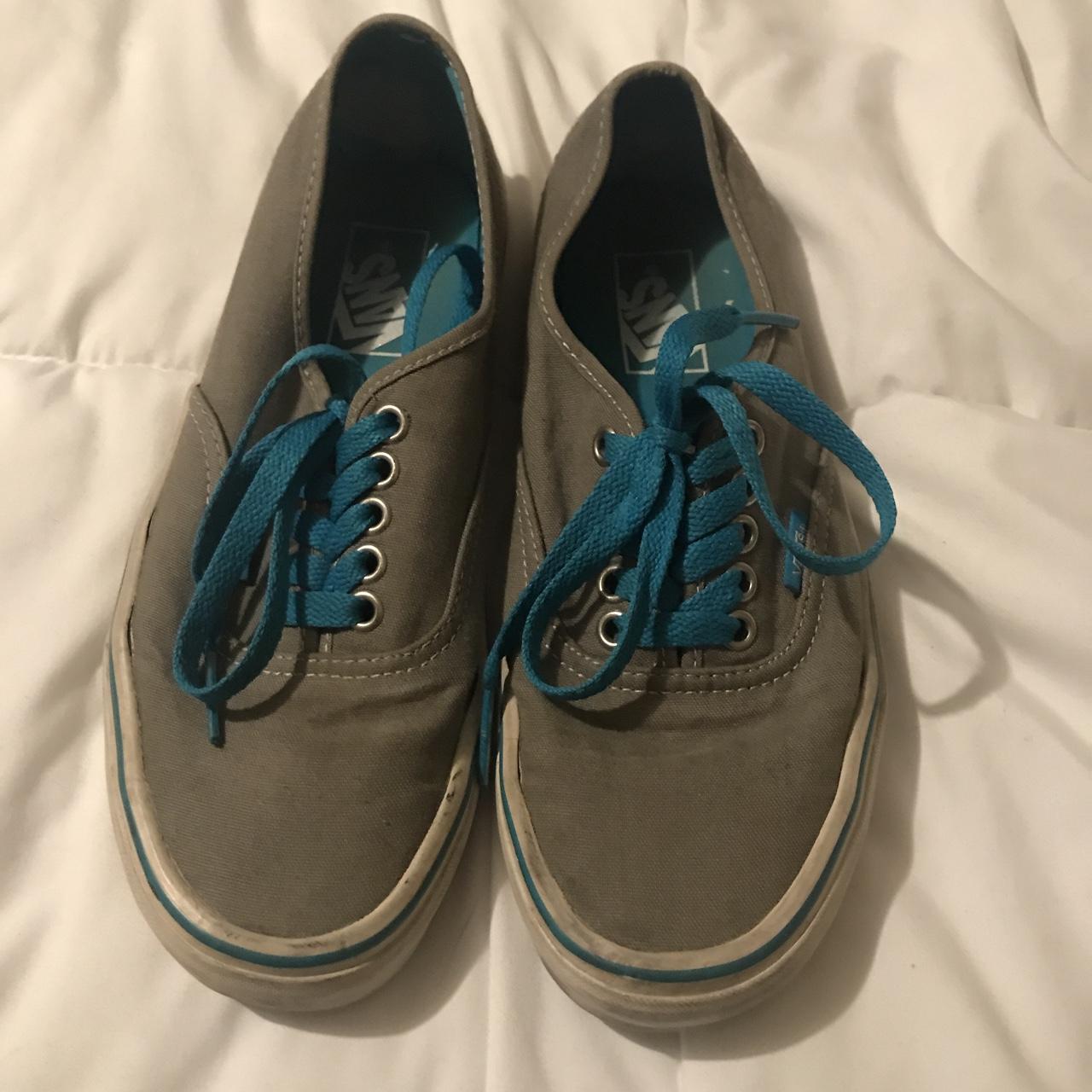 grey vans with blue laces