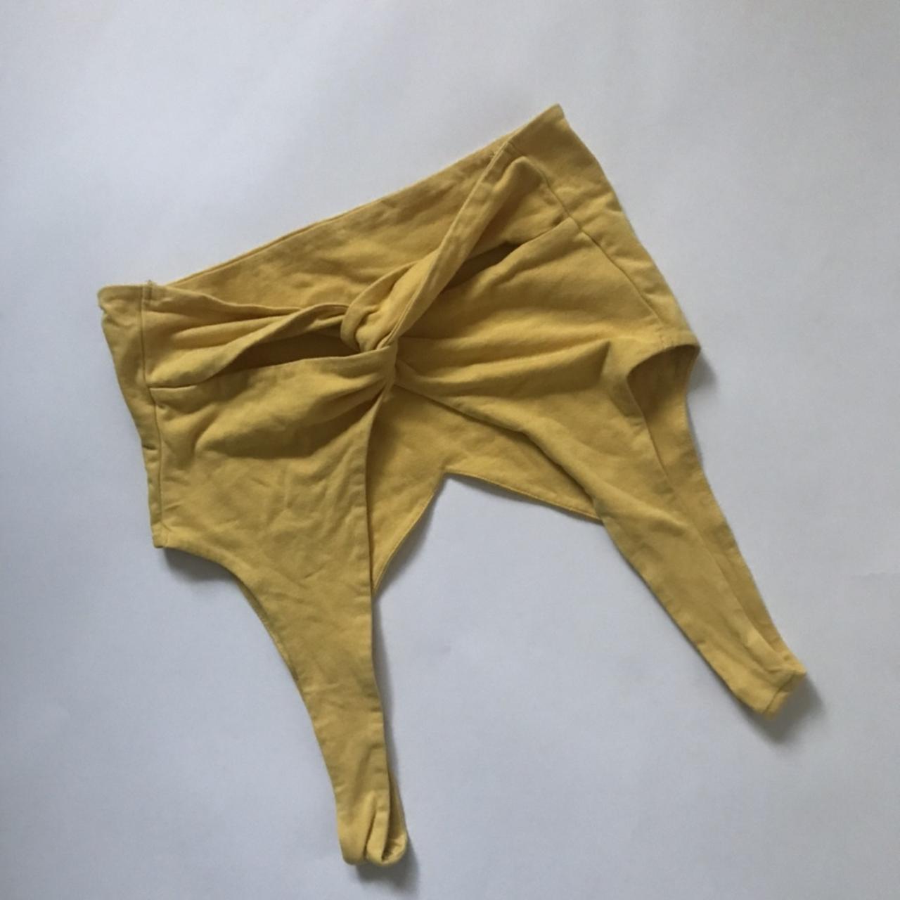 yellow urban outfitters crop top with twist... Depop