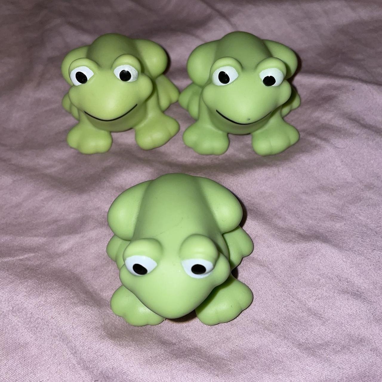 Image of Three plastic toy frogs