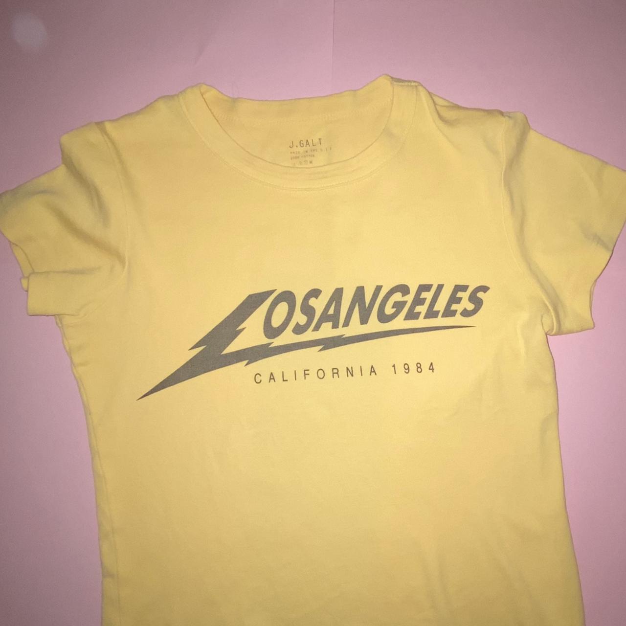 brandy melville yellow los angeles baby tee! super... Depop