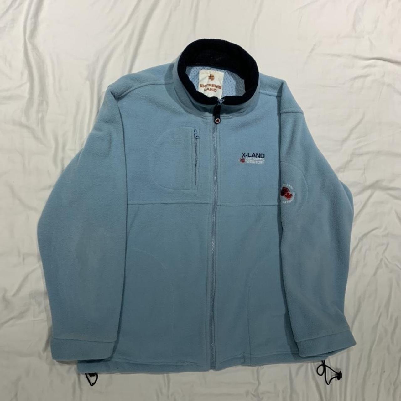 light blue fleece zip up says xxl but more like... - Depop