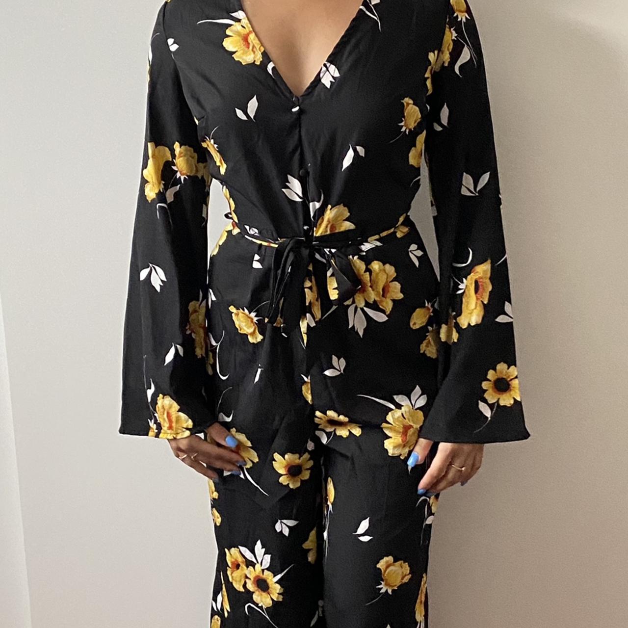 Black jumpsuit with store yellow flowers