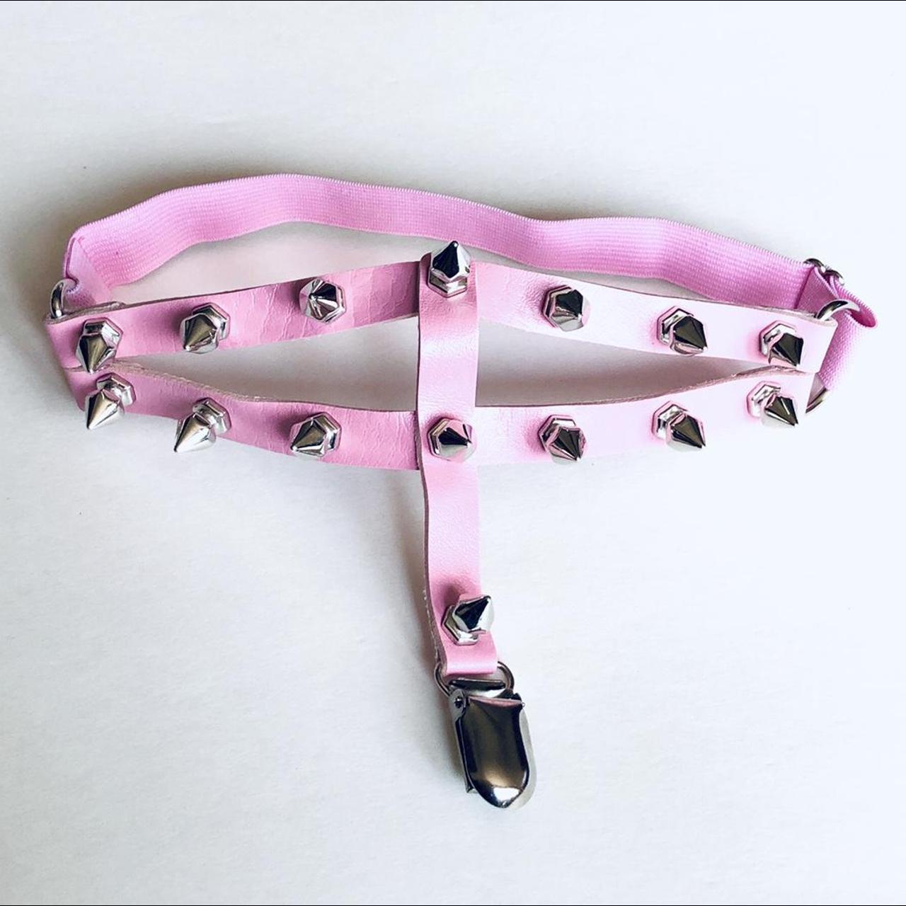 Pink spiked garter belt, one size elasticated... - Depop