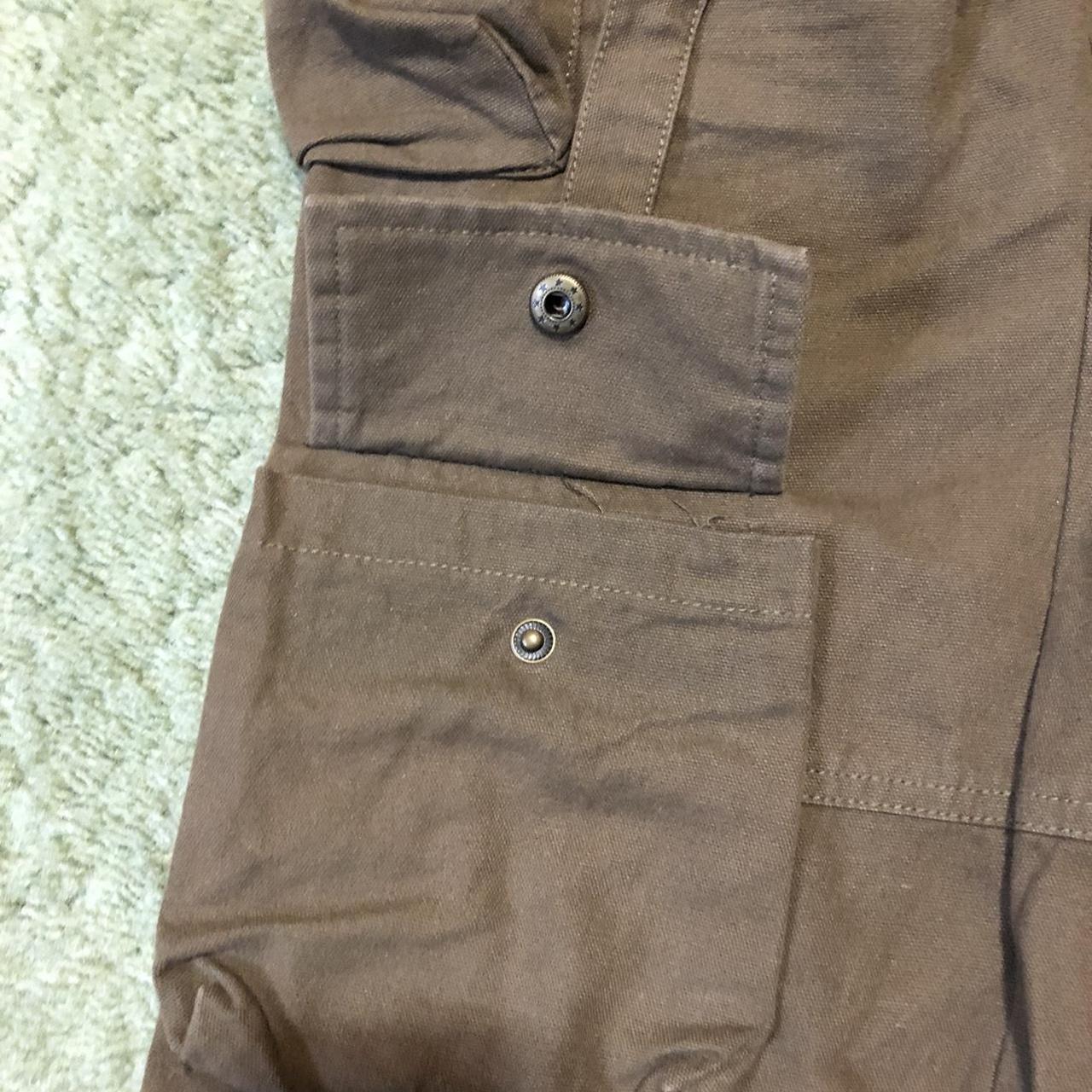 Kody Phillips cargo pants with zippers on side of... - Depop