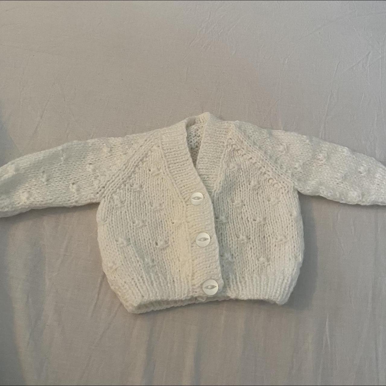 white knitted cardigan newborn