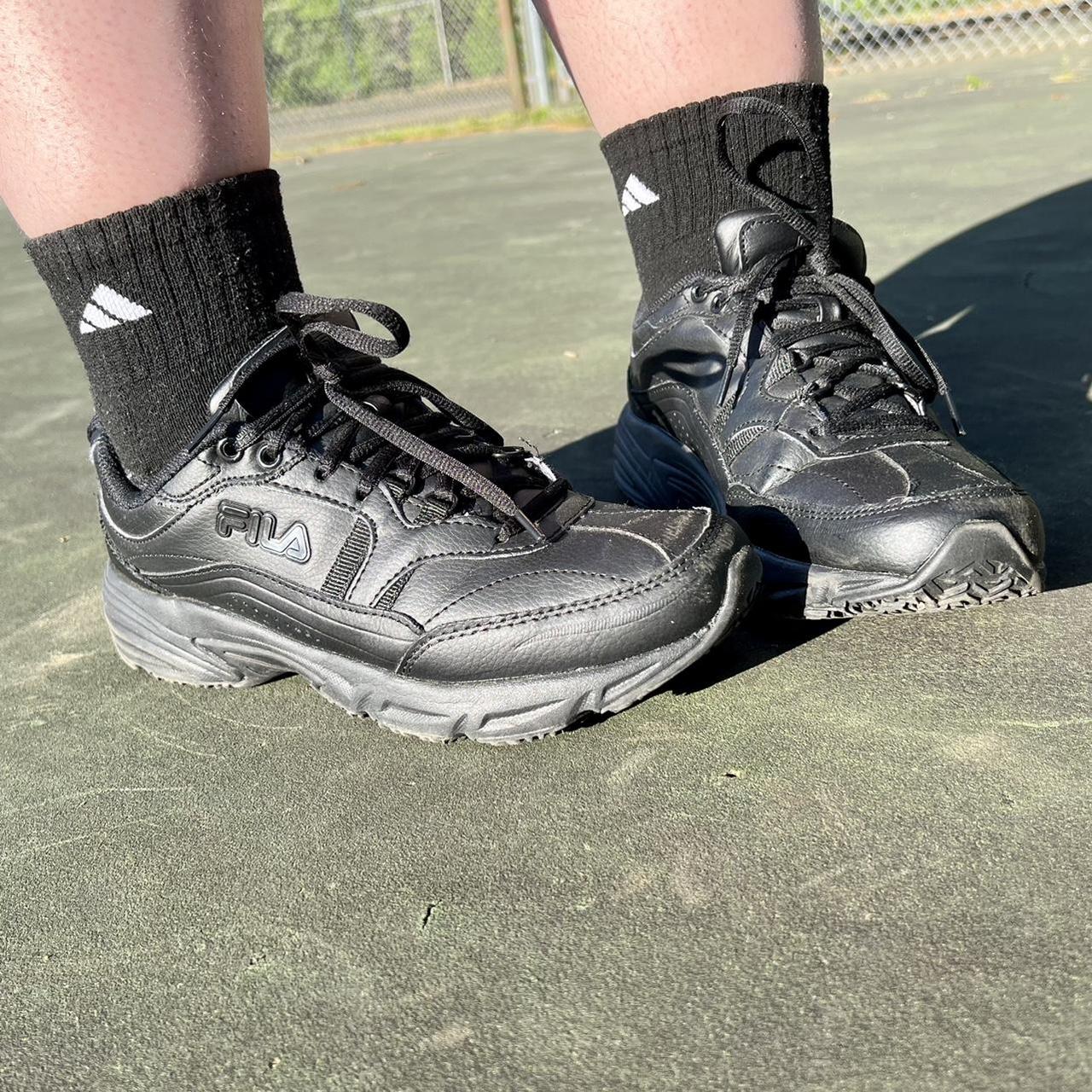 Like New solid black FILA sneakers with adjustable - Depop