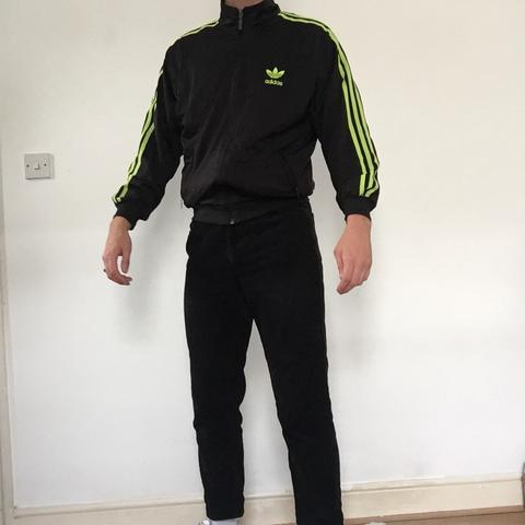 Adidas tracksuit black with hotsell green stripes