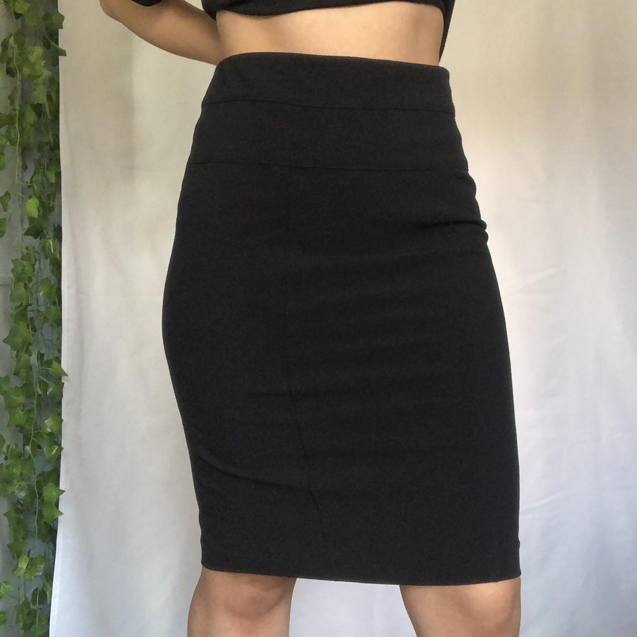 Black knee-length pencil skirt with back slit.... - Depop