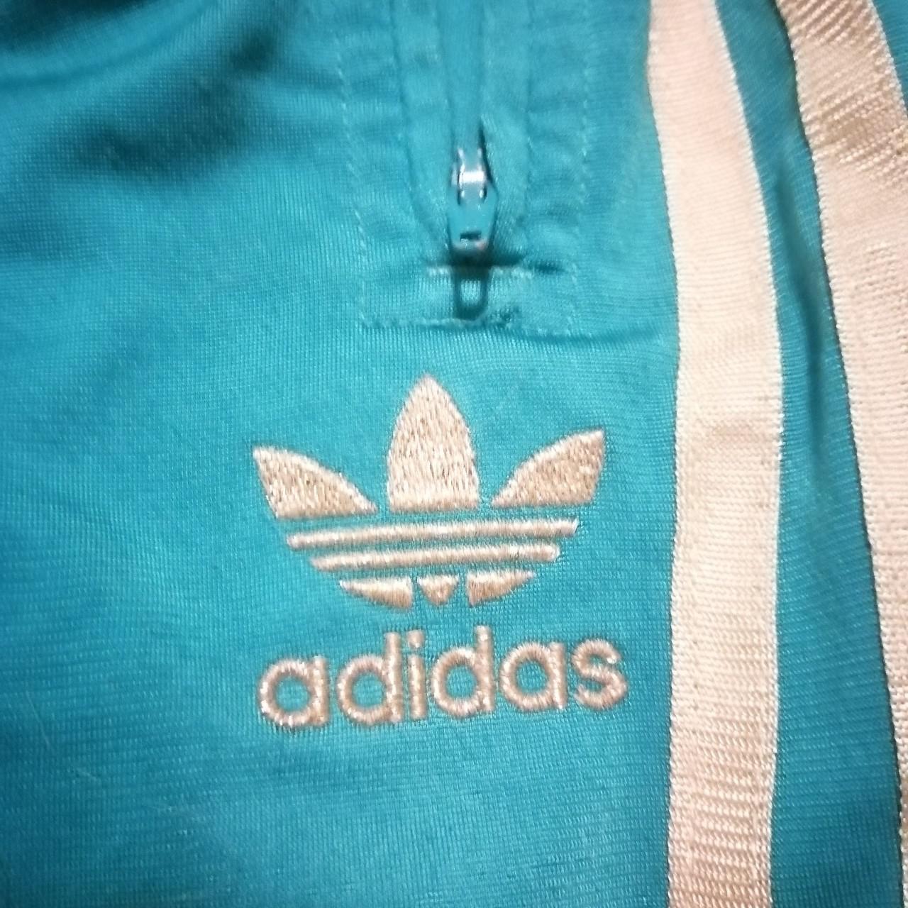 Teal / Green Adidas tracksuit bottoms with gold... Depop