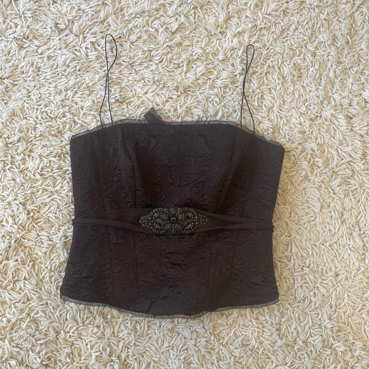 brown corset style top with beautiful broach on the... Depop