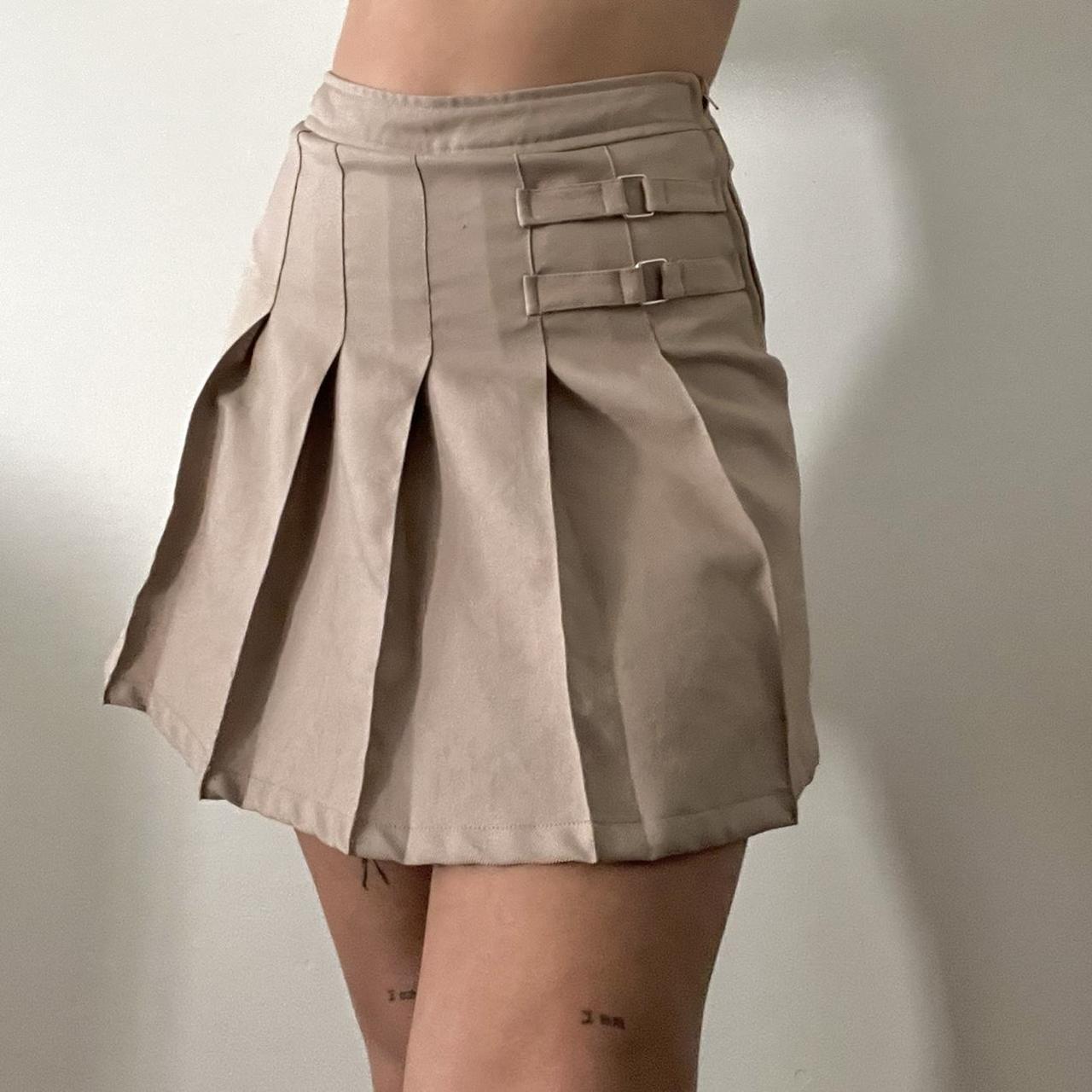 Beige pleated mini skirt cute buckle detailing Depop