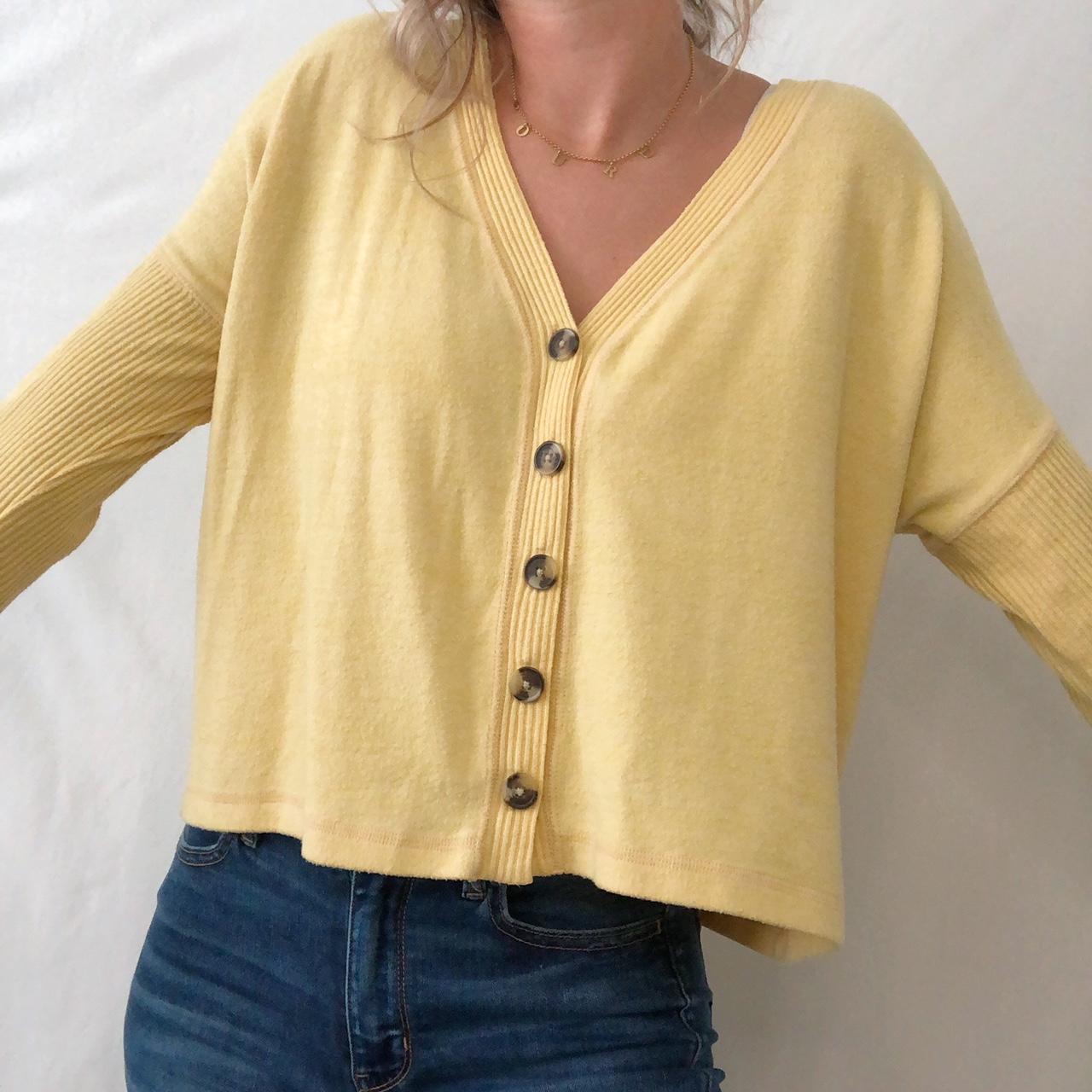 yellow button up sweater