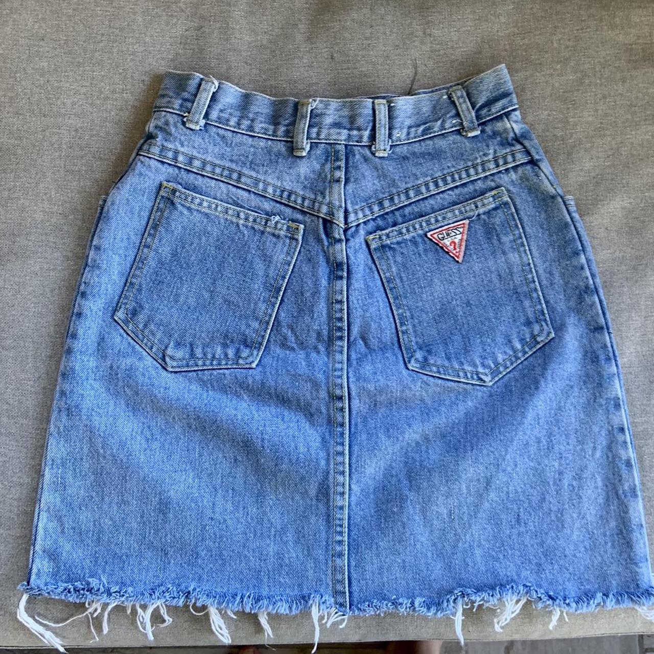Guess vintage denim skirt with raw hem. Marked as a... Depop