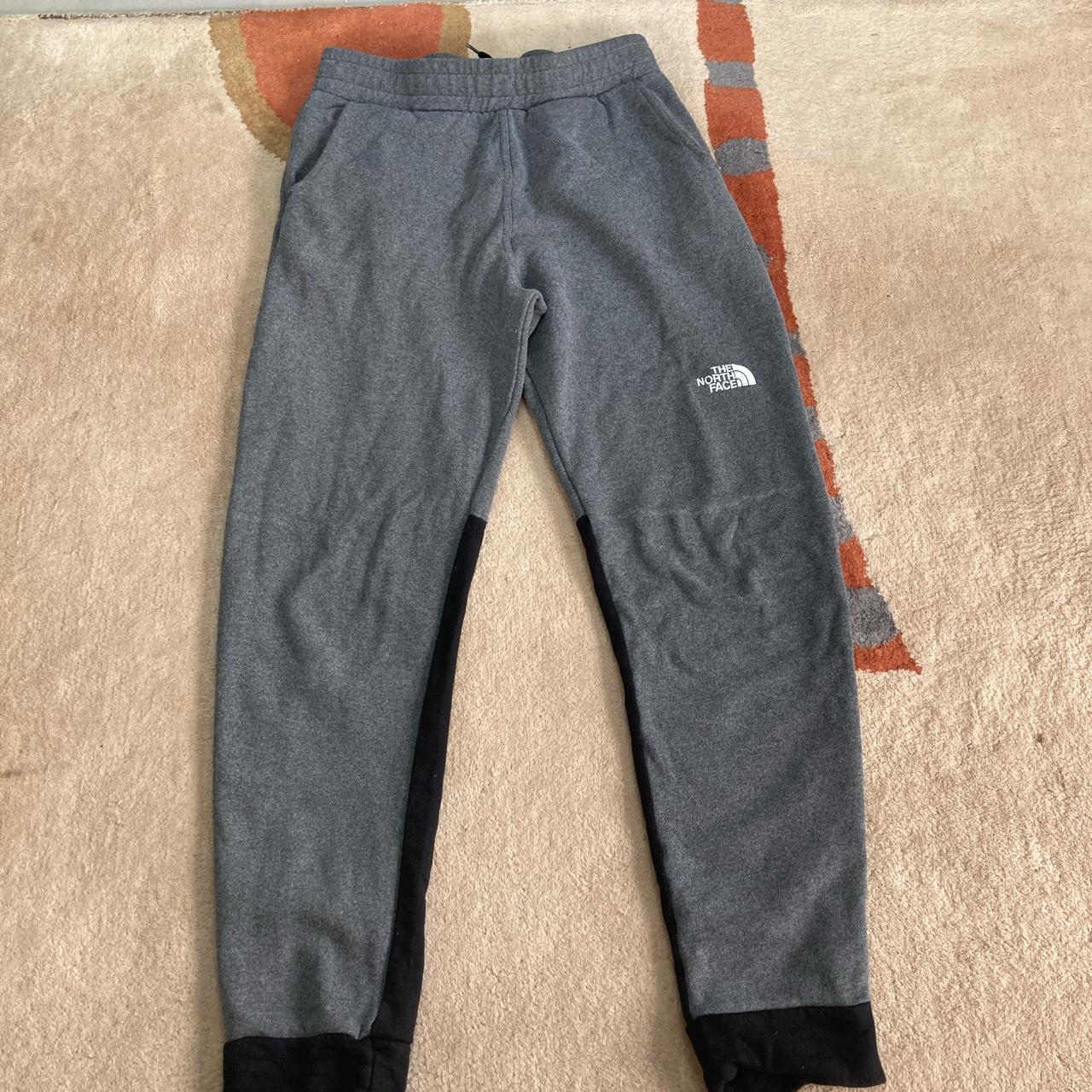 North face grey and black tracksuit bottoms Small... - Depop