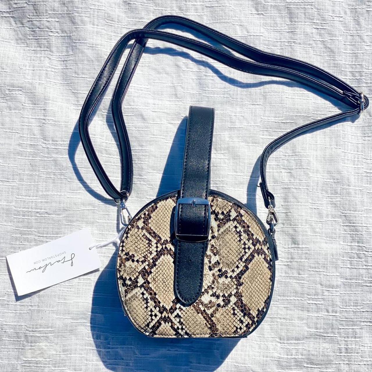 t in a circle logo purse