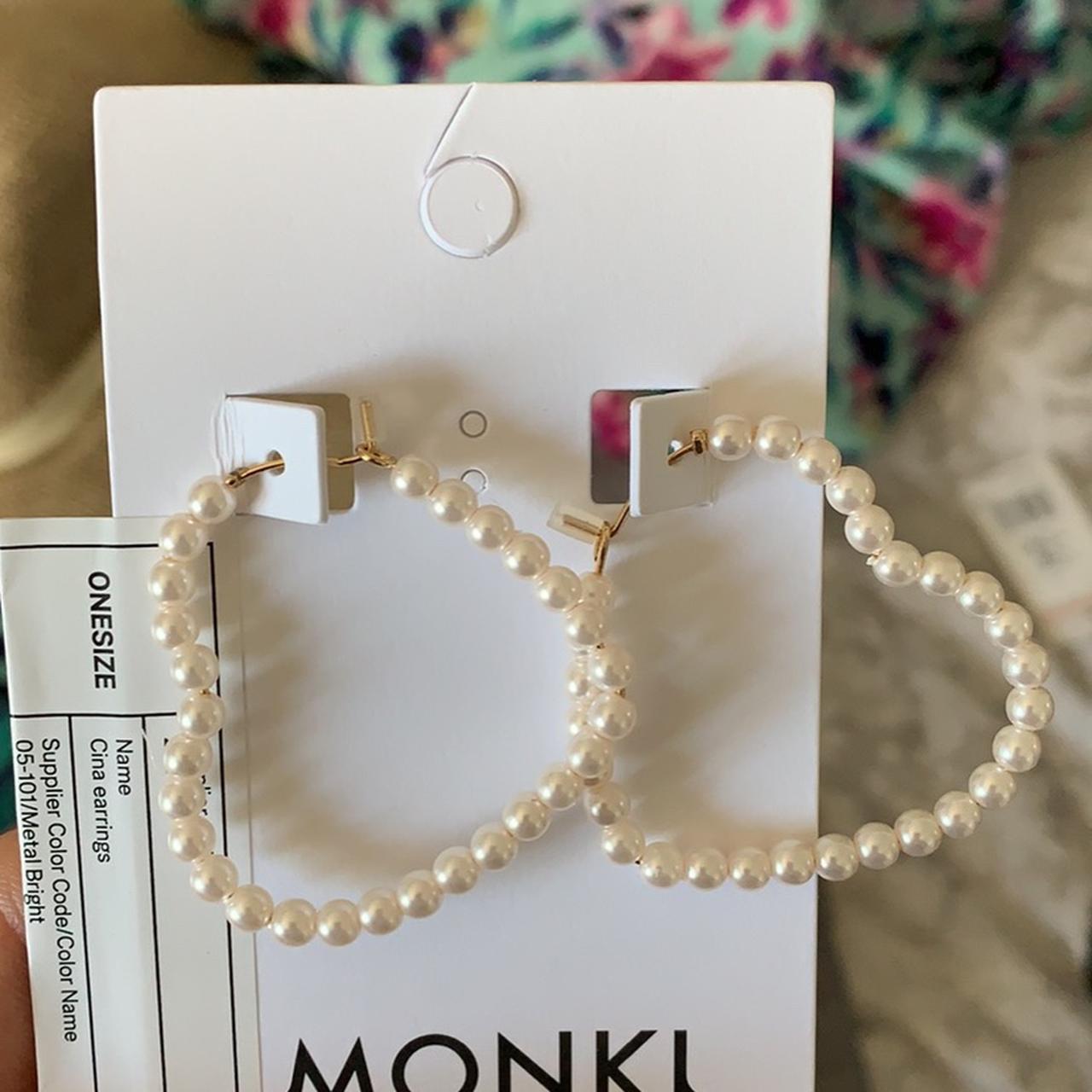 Faux pearl heart shaped hoops Brand is Monki - Main Image