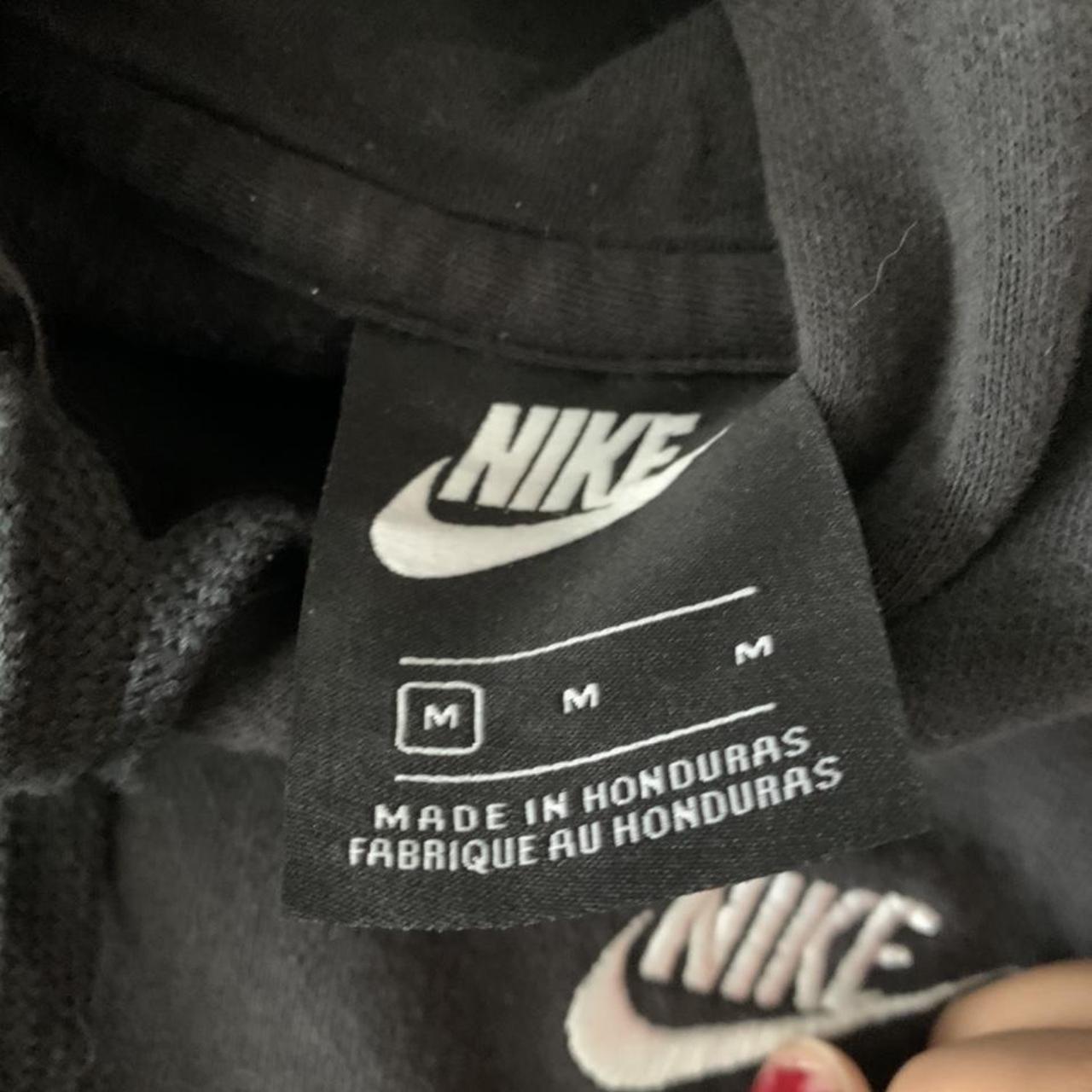 nike hoodiehas bleach stains as shown in pic size... Depop