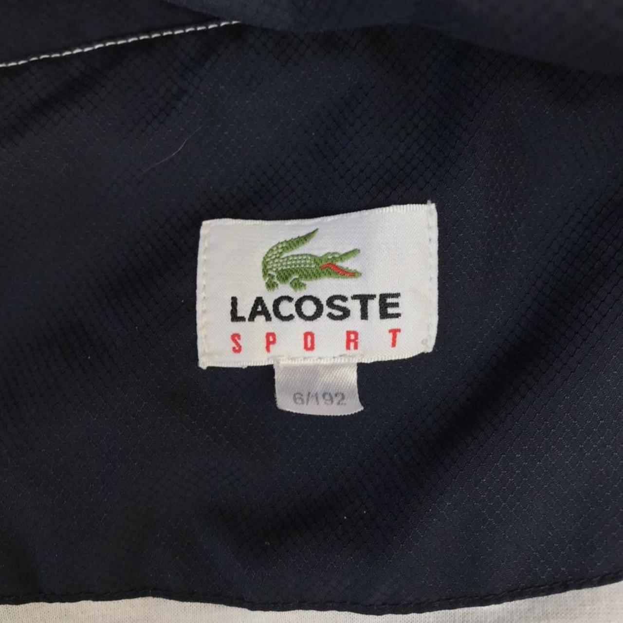 Men’s Lacoste navy and white track jacket in size 6... - Depop