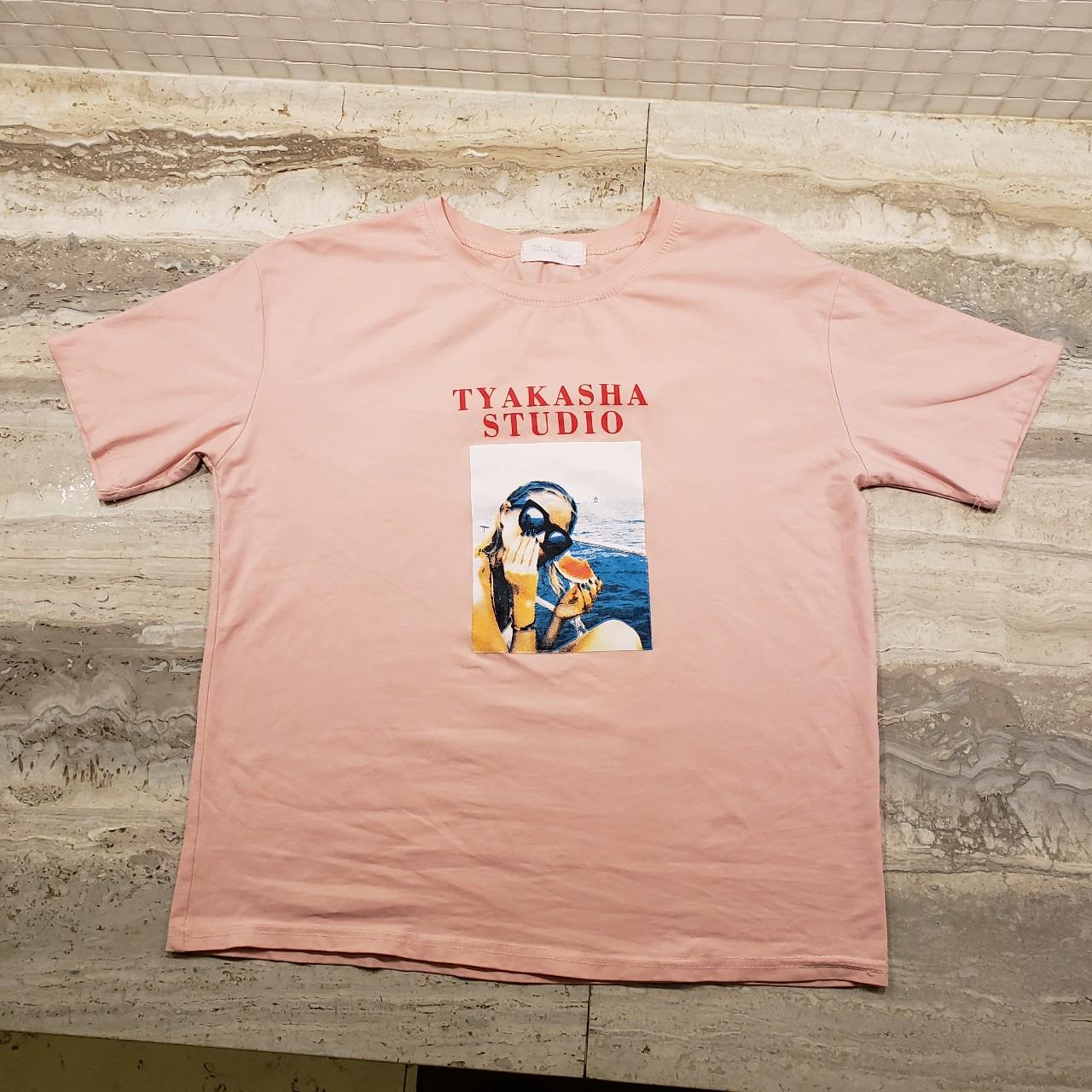 A Tyakasha Studio Graphic T-Shirt. Very light and...