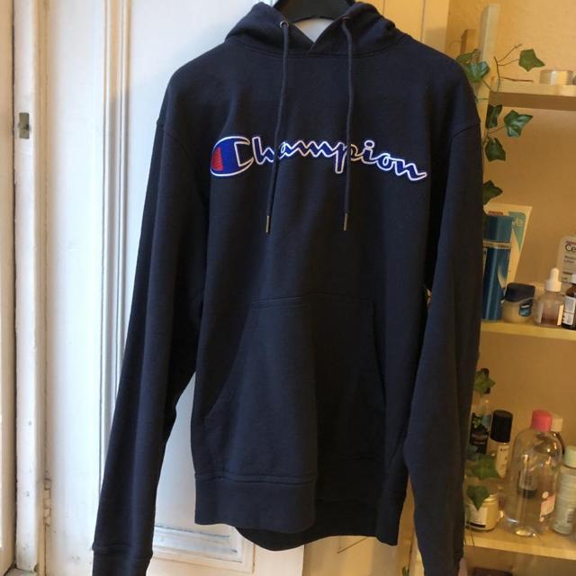 black champion hoodie with blue writing