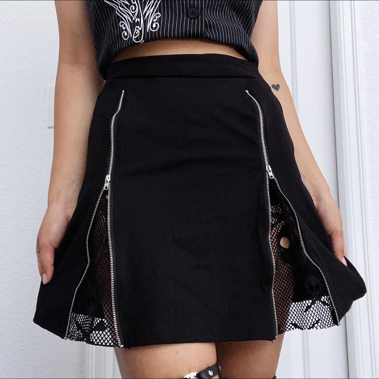 Black skull mini skirt. Never worn, stretchy fabric,... - Depop