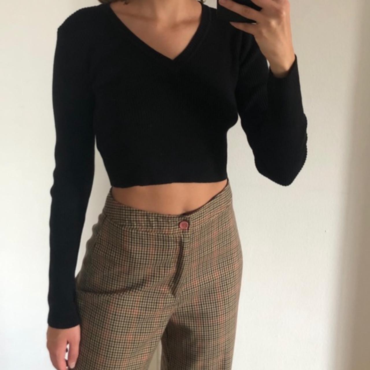 Brandy Melville Milena top is a black ribbed... Depop