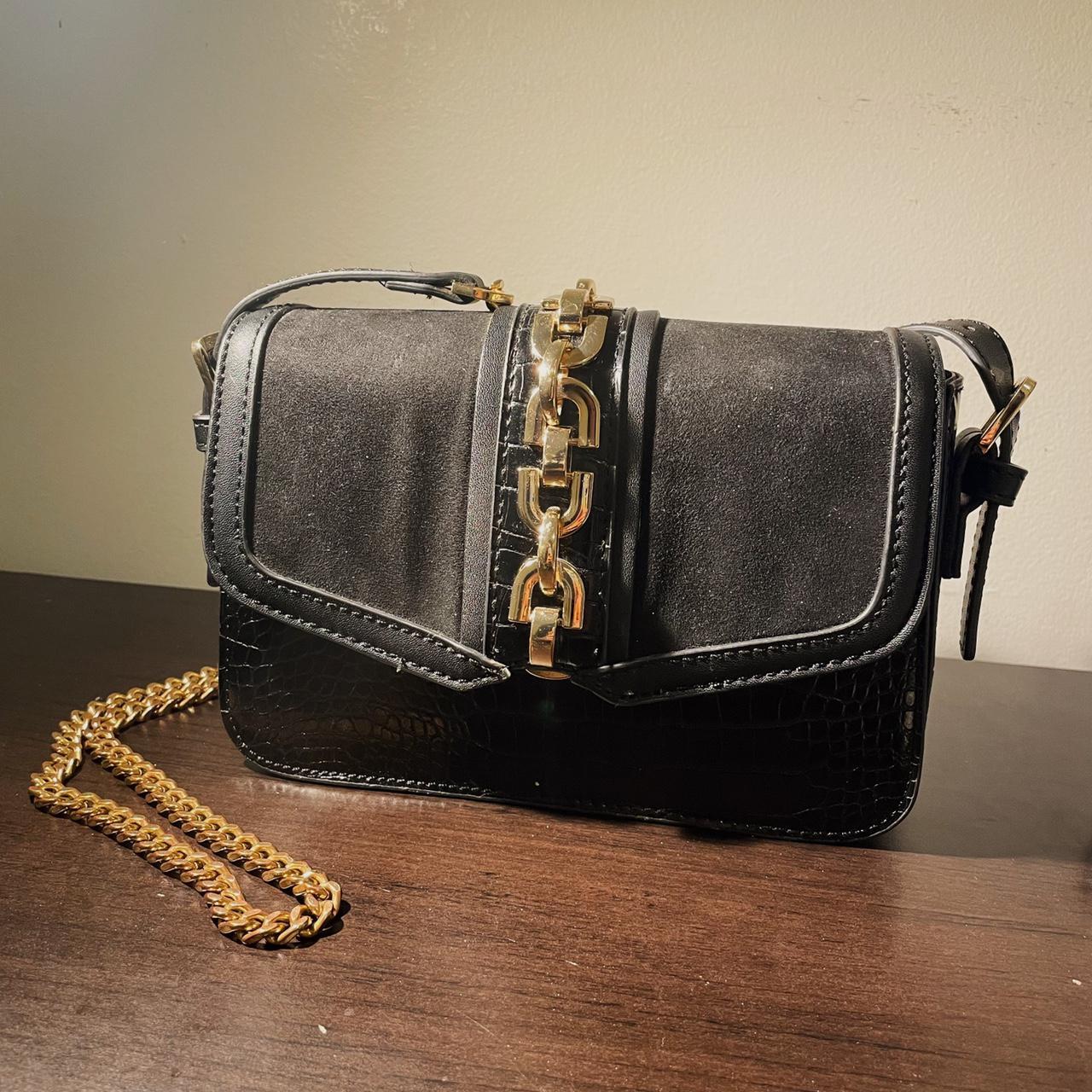 Black crossbody bag with gold chain strap! Has an... Depop
