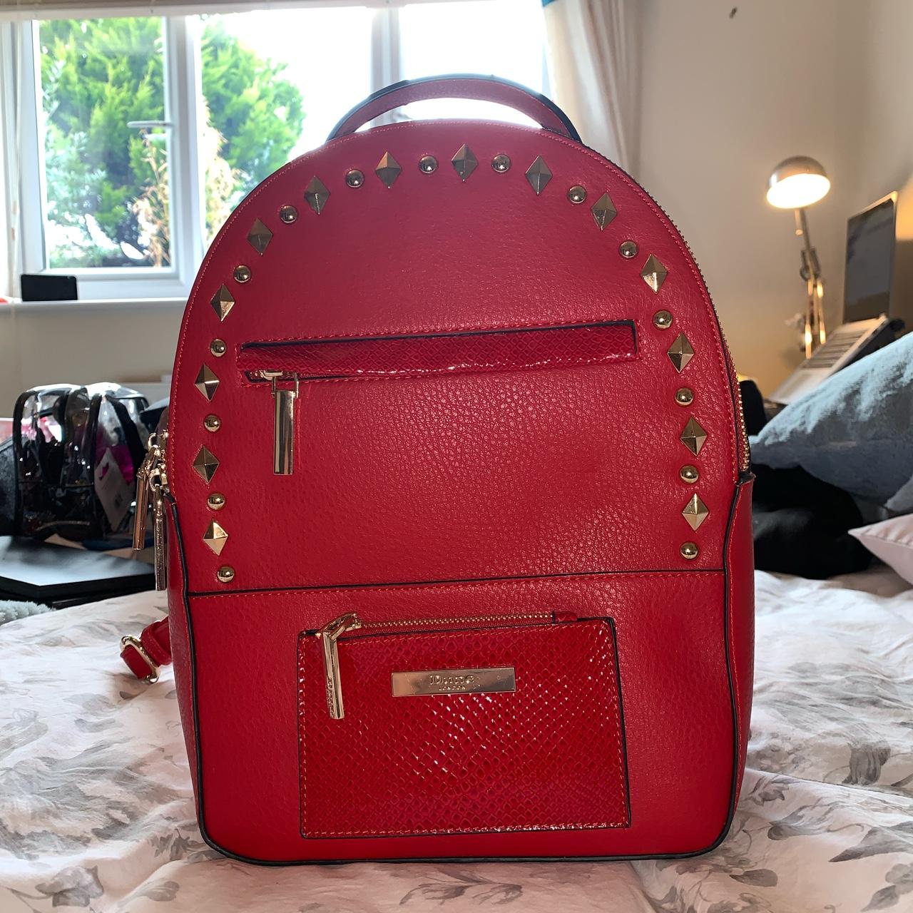 Dune Backpack. Never used. Beautiful red colour with