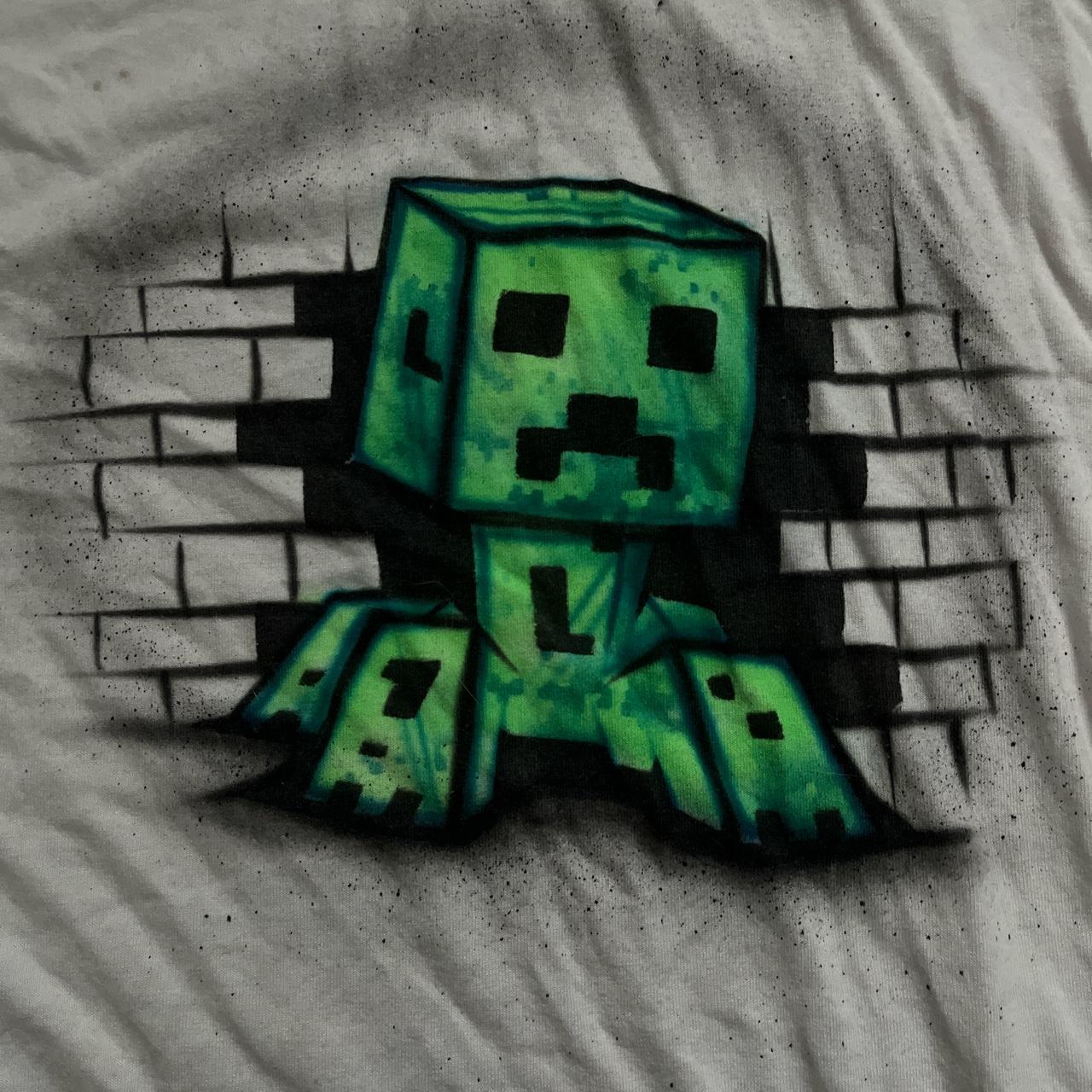 Green minecraft t-shirt with a creeper face design