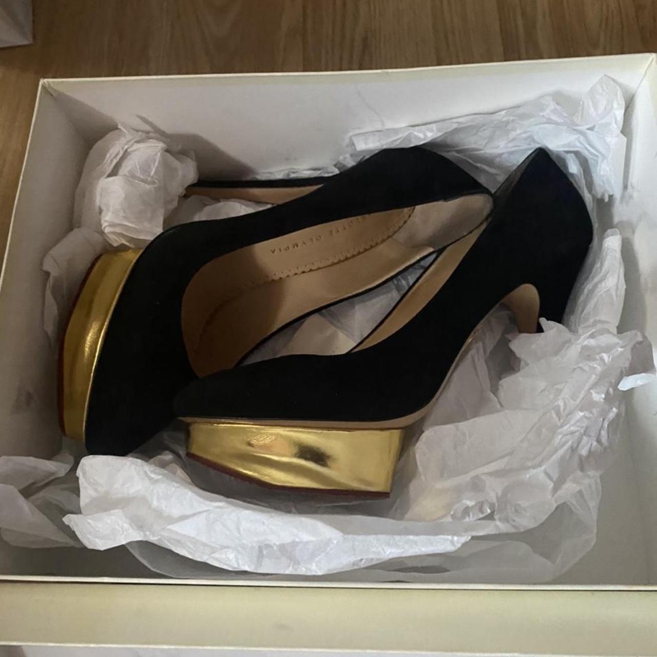 A black with gold pair of Charlotte Olympia dolly... - Depop