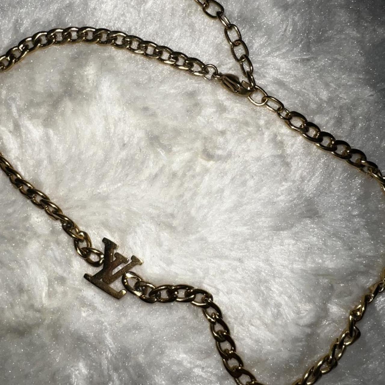 Louis Vuitton flame necklace - Depop