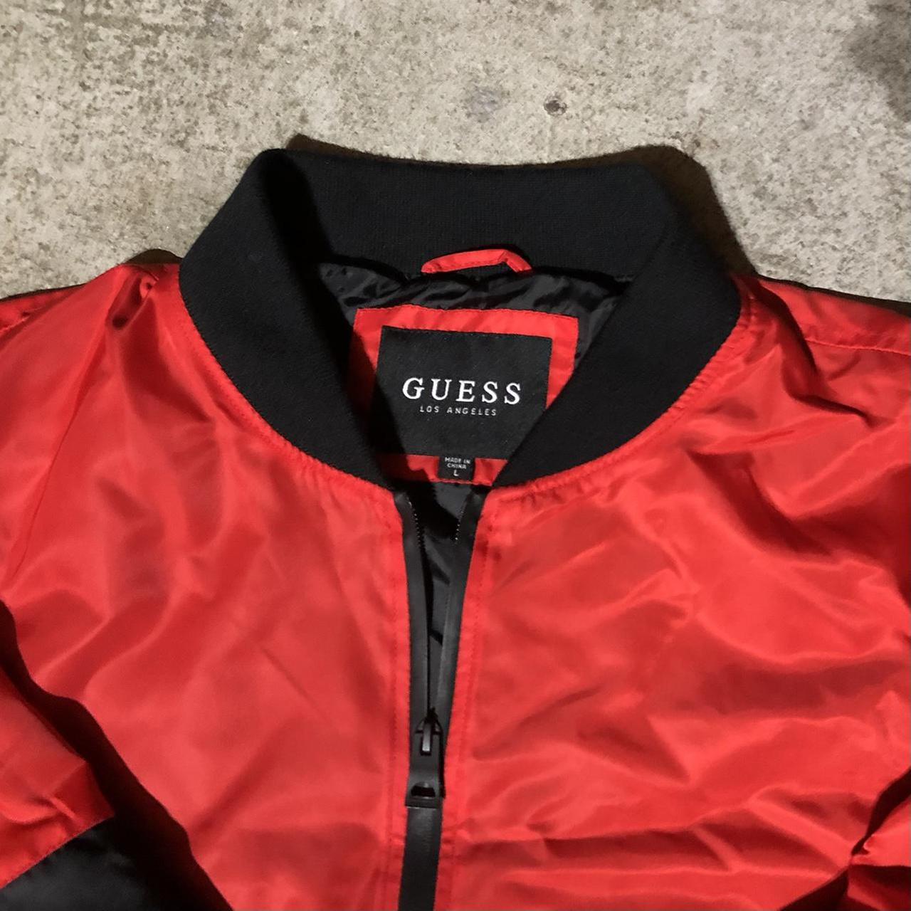 red guess windbreaker