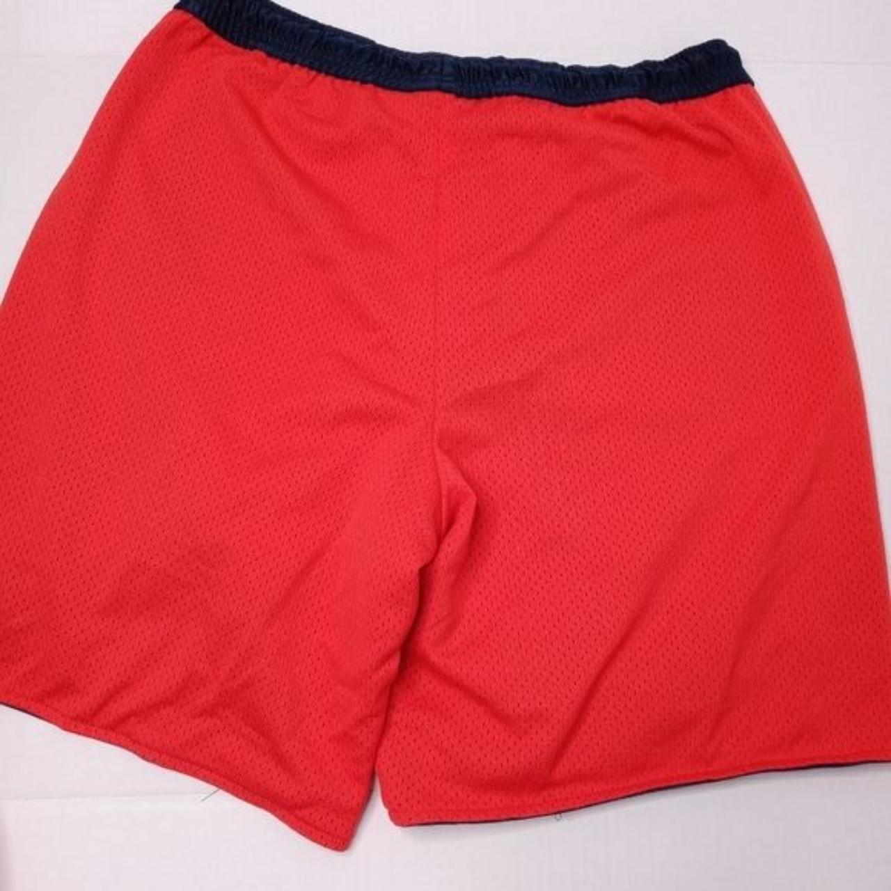 Nike red basketball shorts with navy lining. The... - Depop