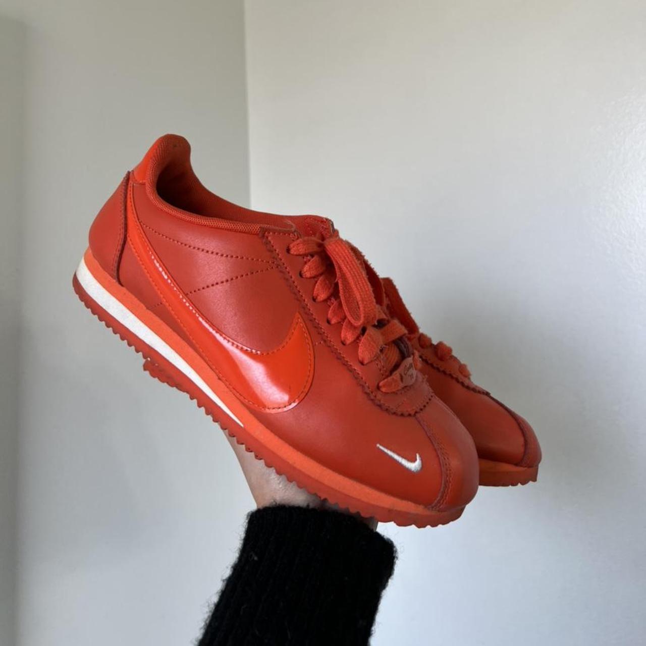 nike cortez orange and black