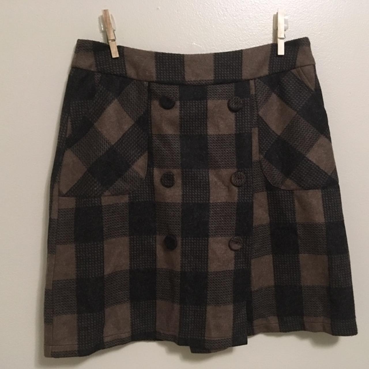 Brown and black plaid skirt with buttons and has... - Depop