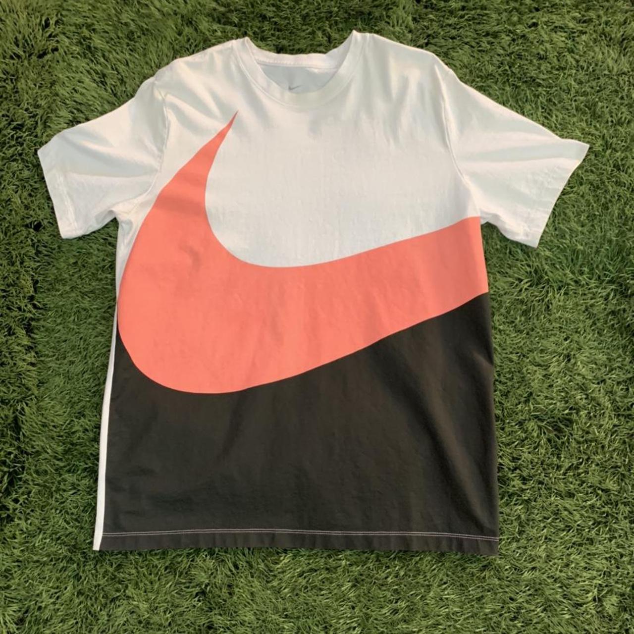 pink black and white nike shirt