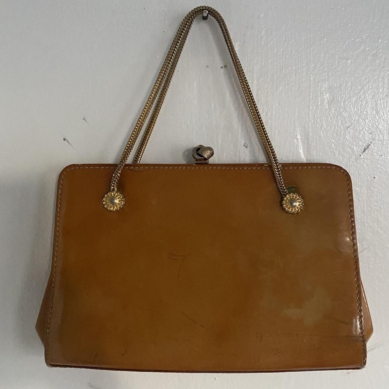 Vintage leather purse with gold chain strap. Signs... Depop