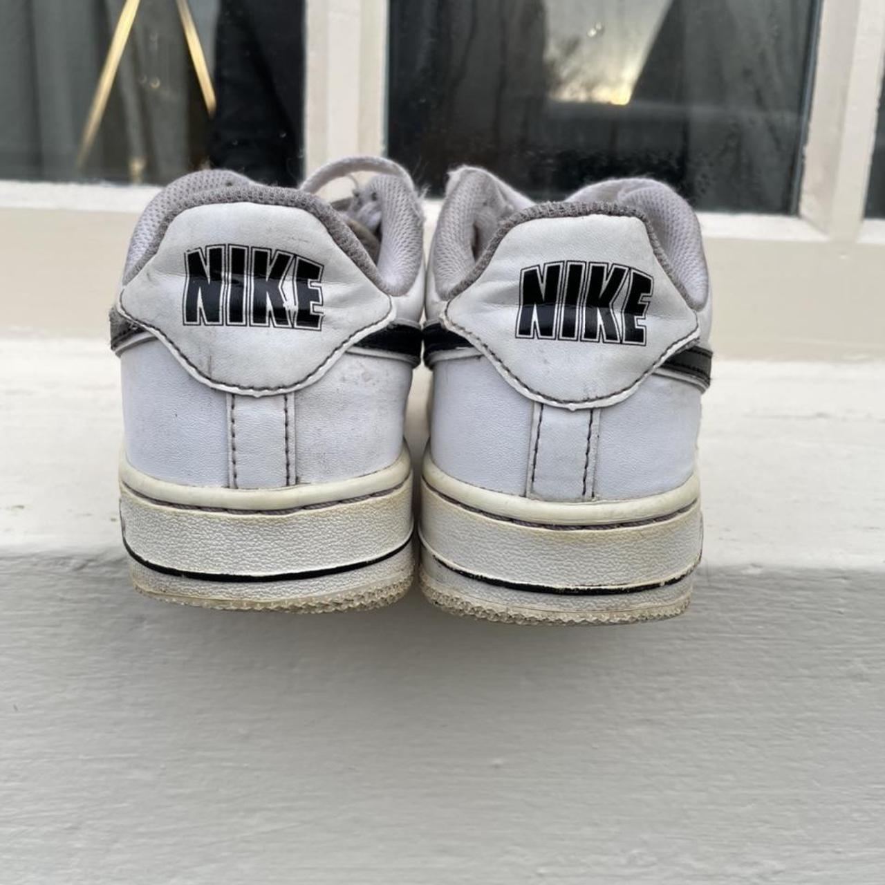 white air force 1s black tick