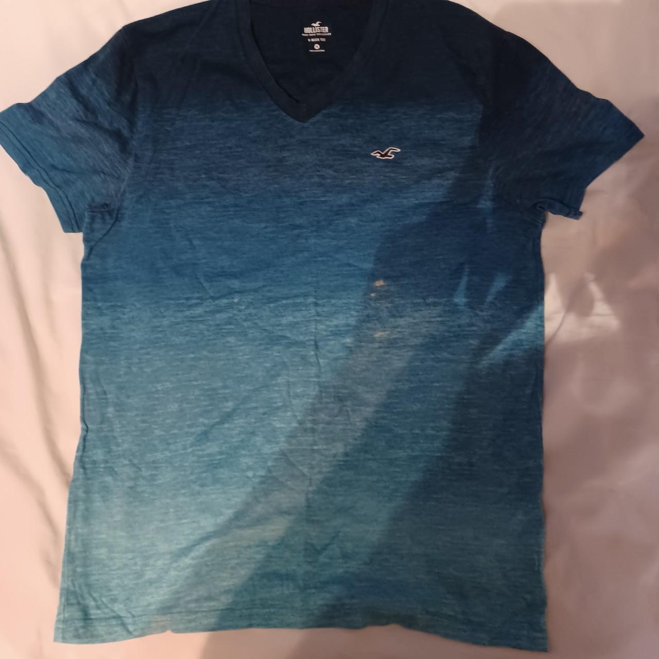 Faded blue tshirt. Goes from light to dark. V neck... - Depop