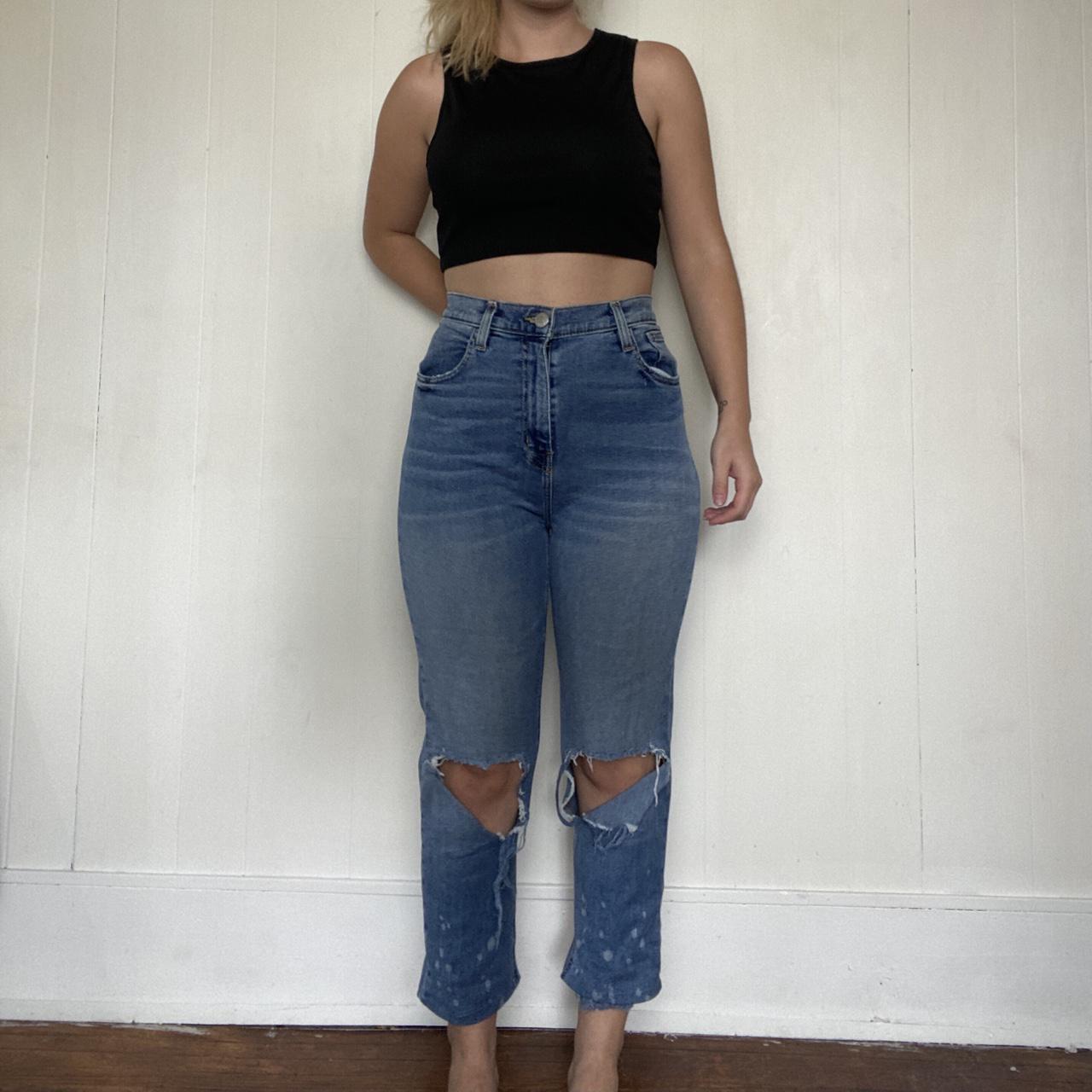 High waisted light wash girlfriend jeans. Has a raw... - Depop