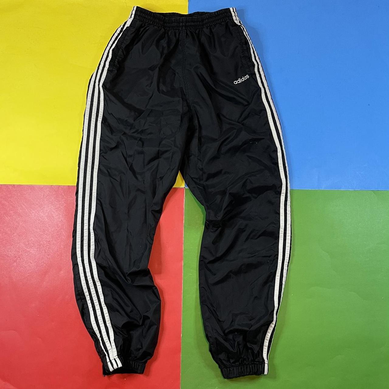 Vintage Adidas pants. 90’s wind pants in black with... - Depop