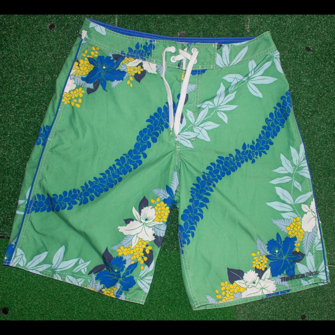 Nautica Blue Beach shorts. Floral design with a... Depop