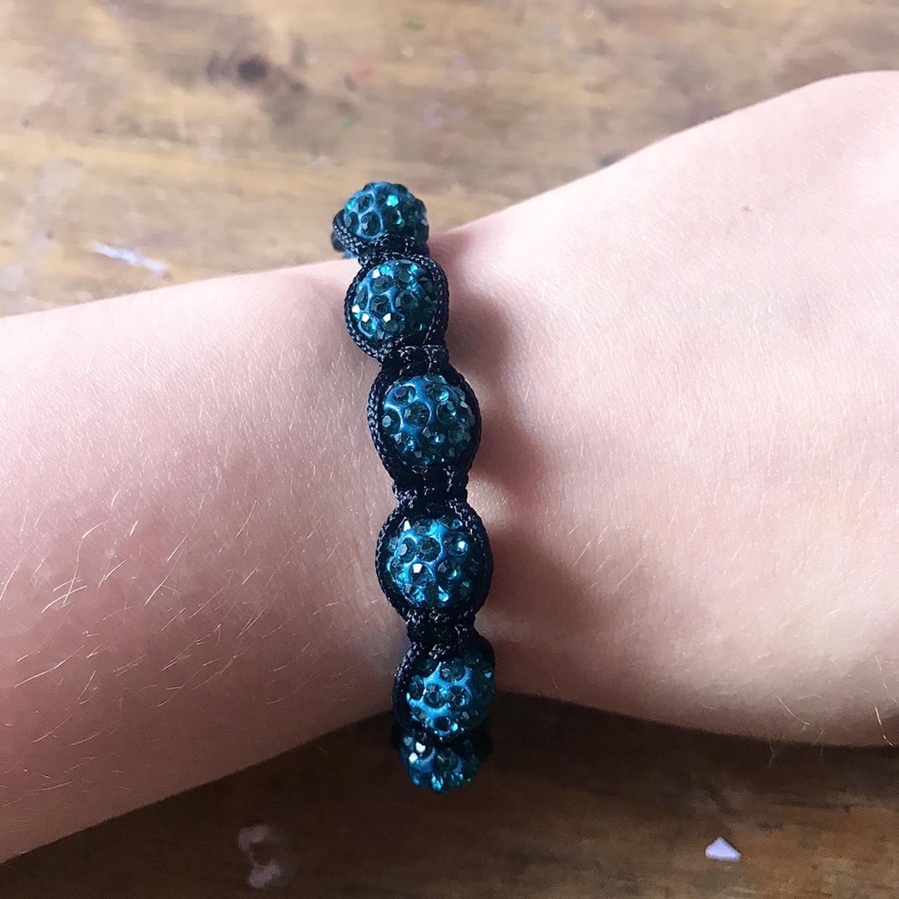 A turquoise blue fake crystal bracelet with magnetic... - Depop