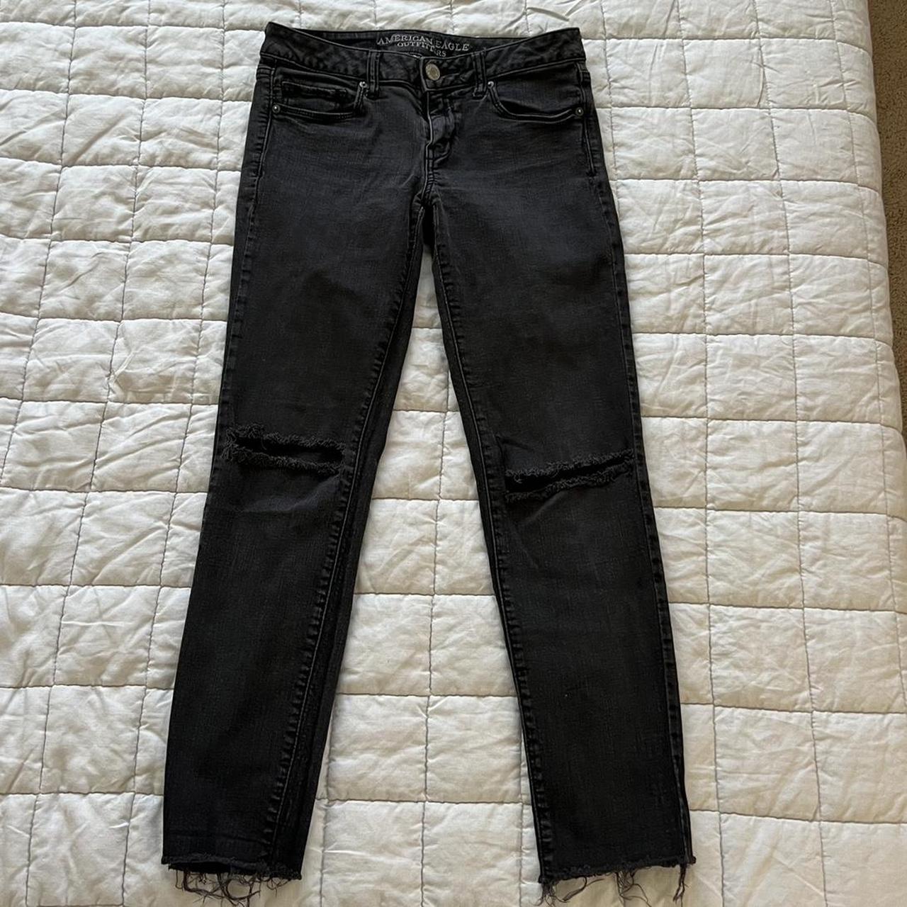 Faded black American Eagle low rise jeans ripped knees - Depop