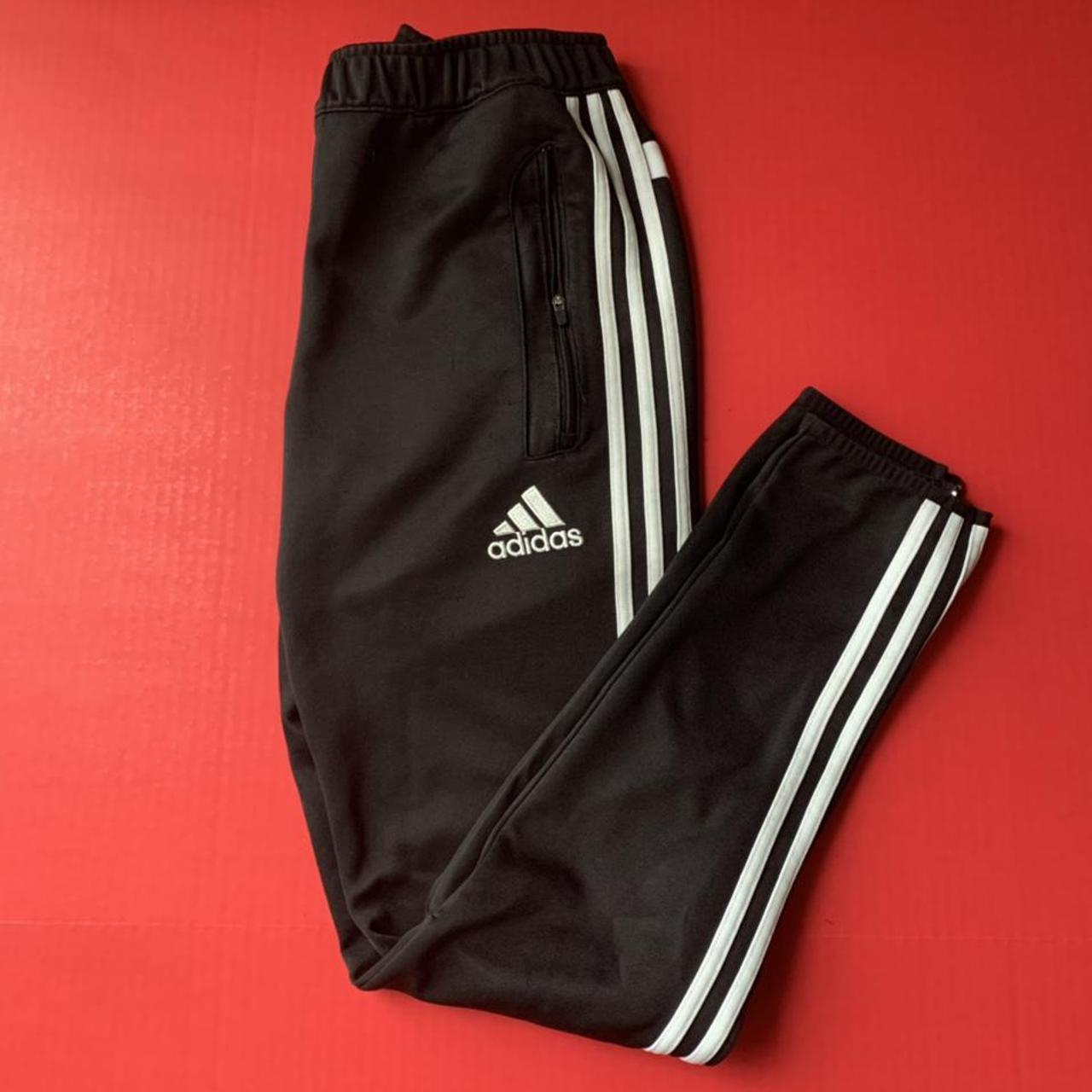 Adidas jogging pants. Has zipper pockets and zippers... - Depop