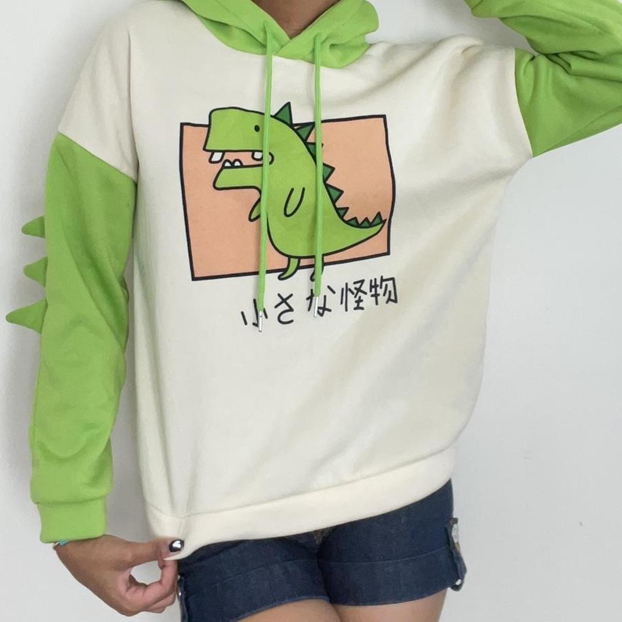 Cute green dinosaur hoodie size L but runs small... - Depop