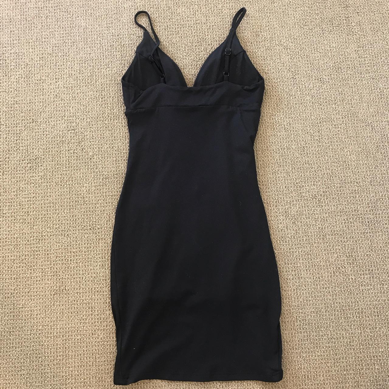 Black dress with left side ruche, padded breast cups... - Depop