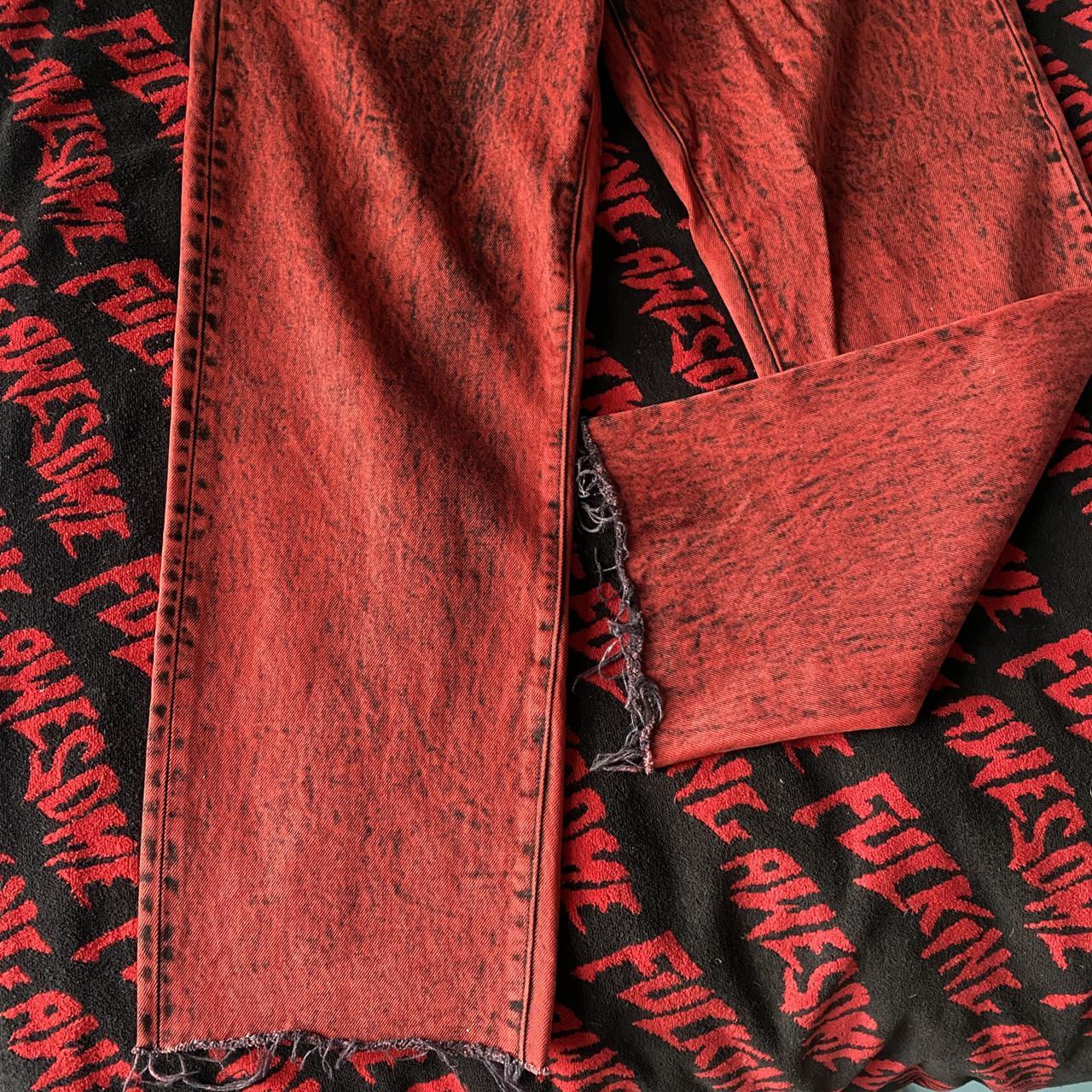 Supreme red denim jeans with paint wash look size 34