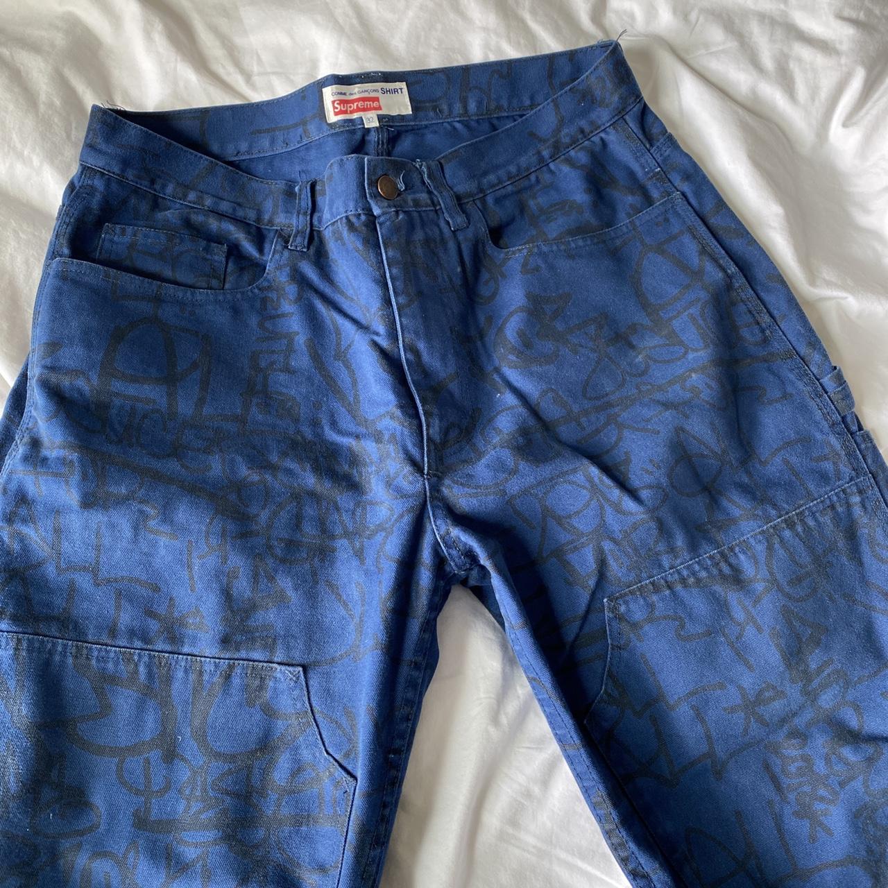 Supreme red denim jeans with paint wash look size 34