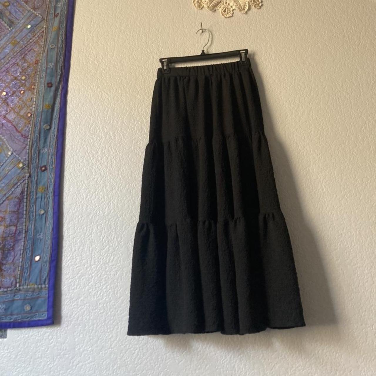 black layered skirt. the skirt would be best worn in... - Depop